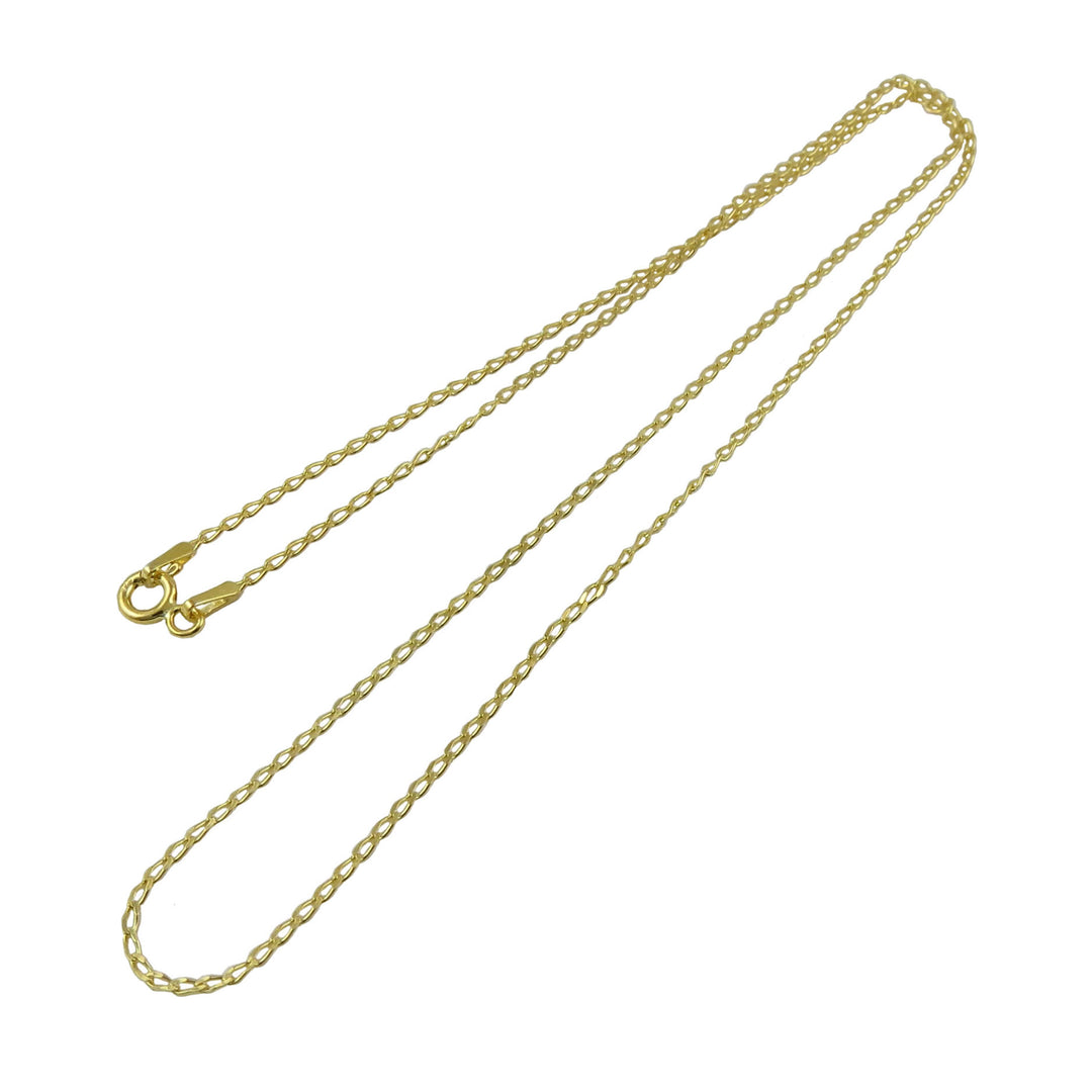 Gold curb chain necklace on a white background