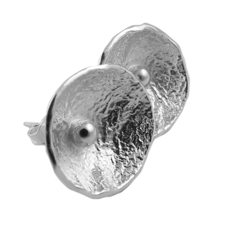 Pair of silver textured poppy flower earrings on a white background