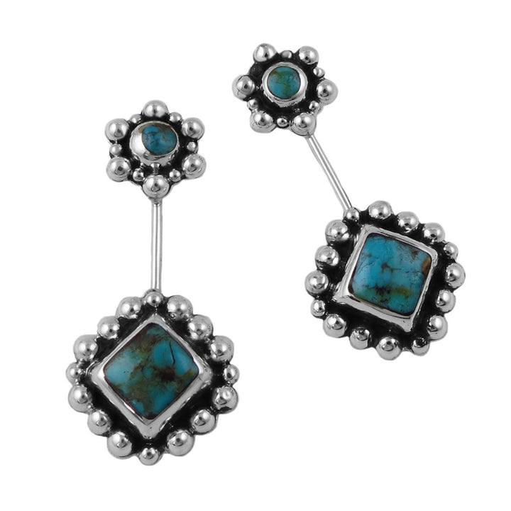 Silver earrings with turquoise stones on a white background