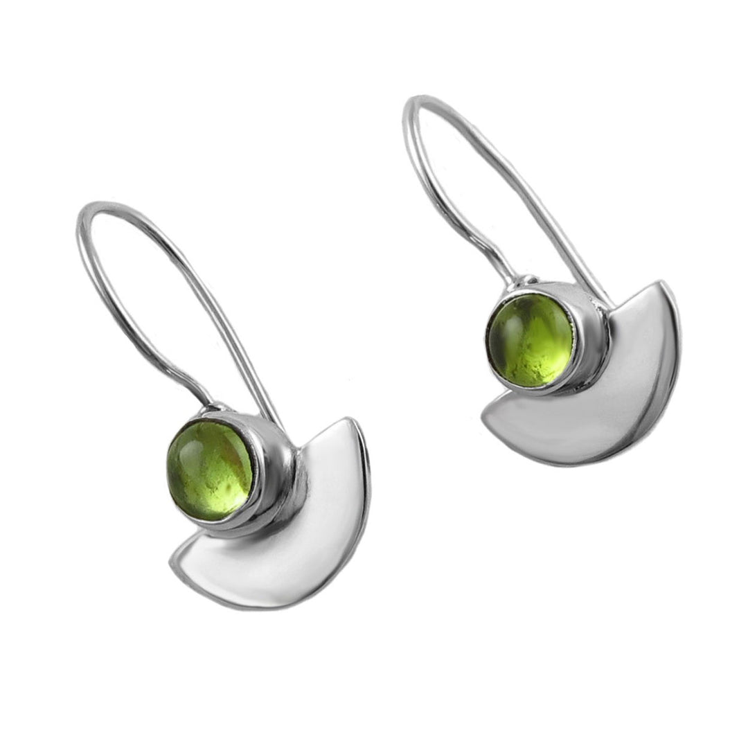 Silver earrings with green peridot gemstones on a white background