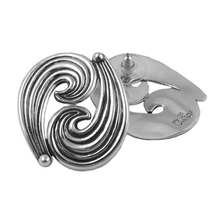 Sterling silver large spiral design earrings on a white background