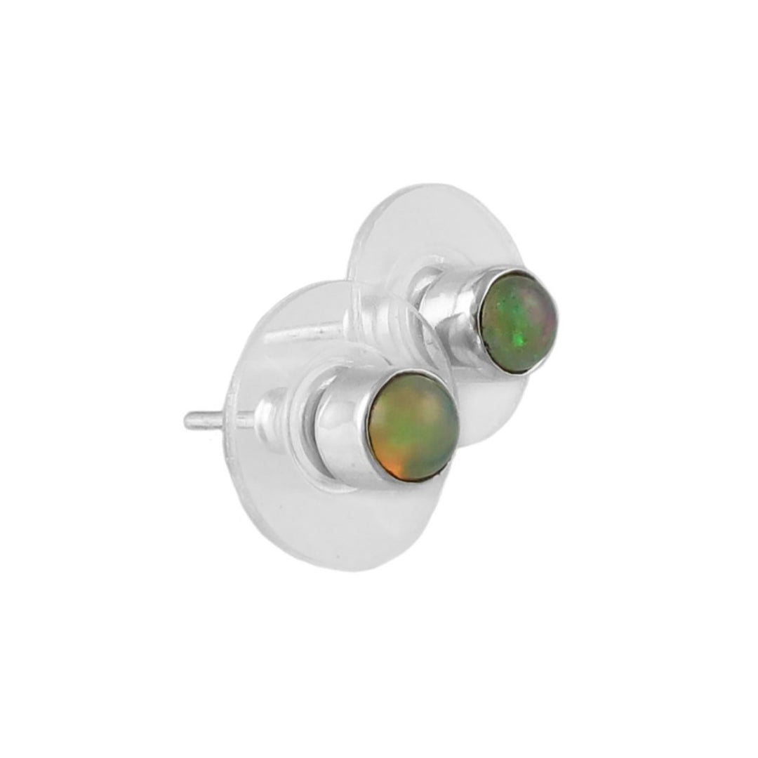 Pair of silver earrings with green opal gemstones on a white background