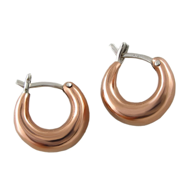 Pair of copper and silver mixed metal  hoop earrings on a white background