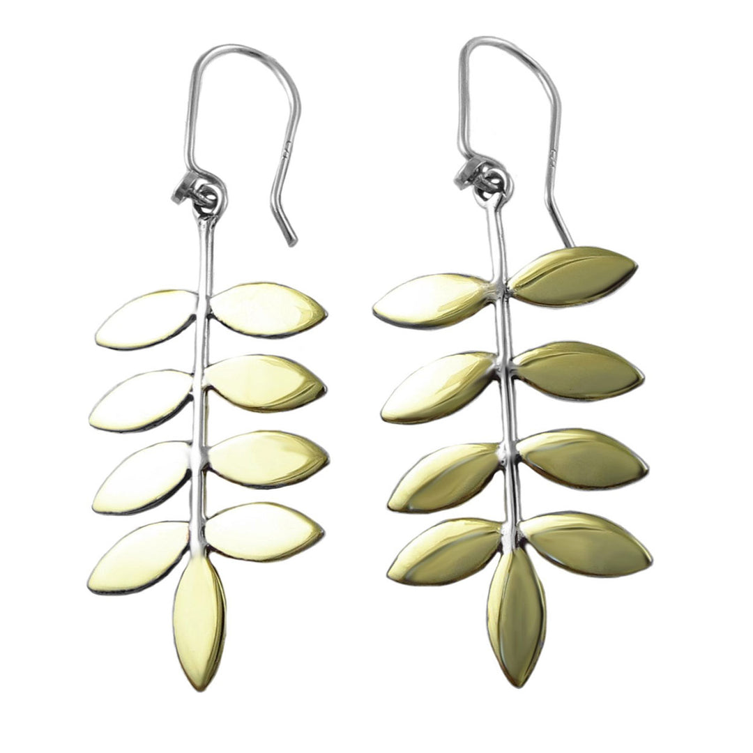 Pair of leaf-shaped earrings in silver and gold on a white background