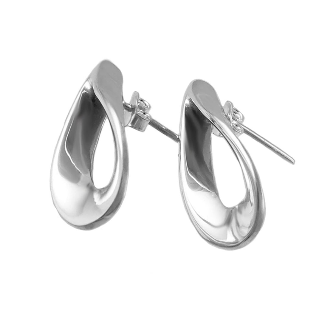 Pair of handmade Mexican silver earrings on a white background