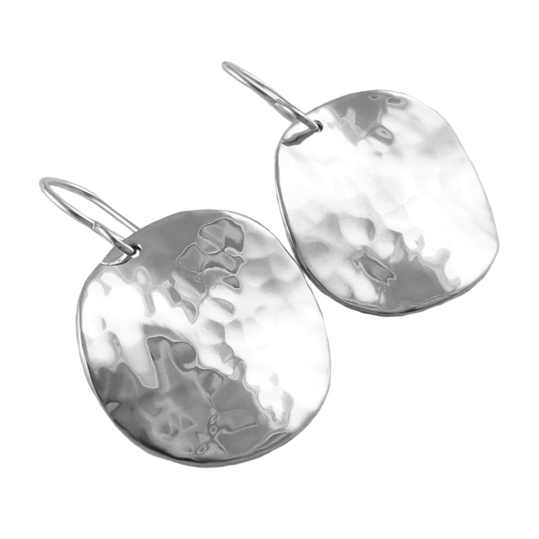 Large pair of solid sterling silver earrings with textured hammered finish on a white background