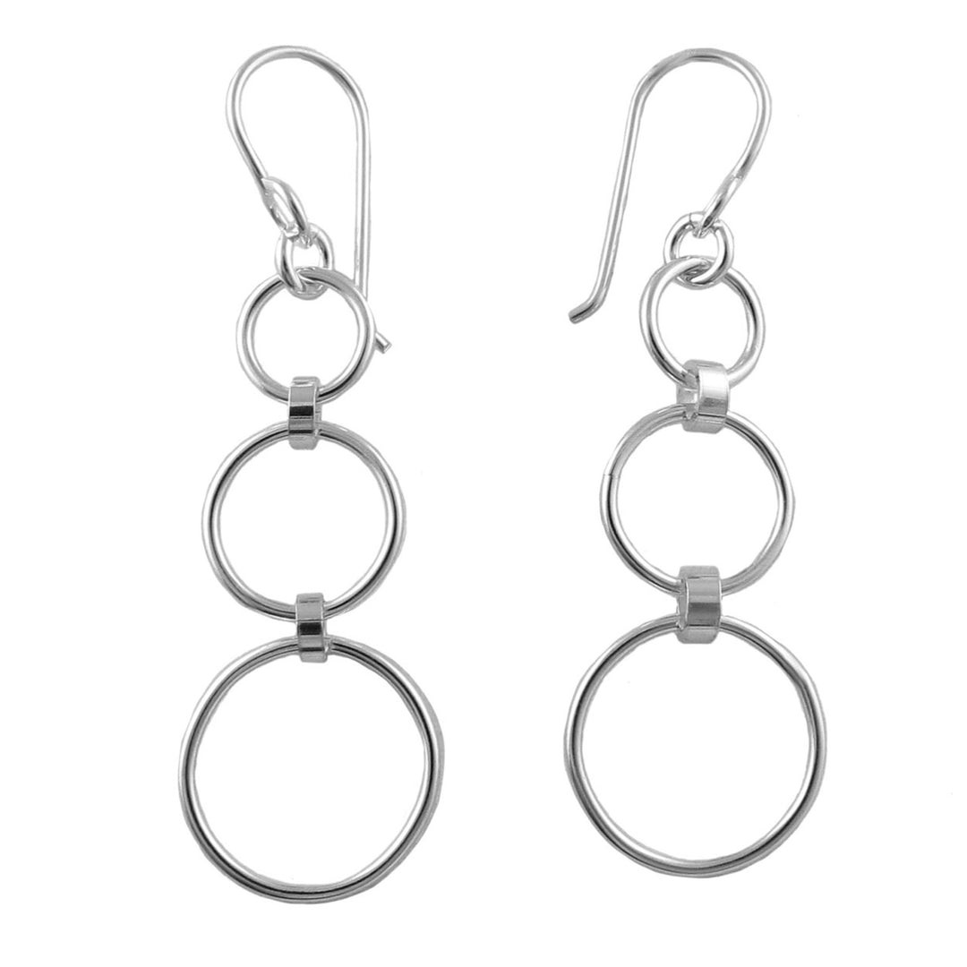 Pair of long 925 silver triple hoop earrings on a white background