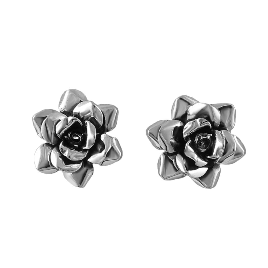 Pair of handmade 925 silver rose flower-shaped earrings jewellery on a white background