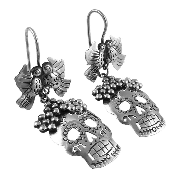 Mexicaan 925 sterling silver sugar skull and bird day of the dead earrings on a white background