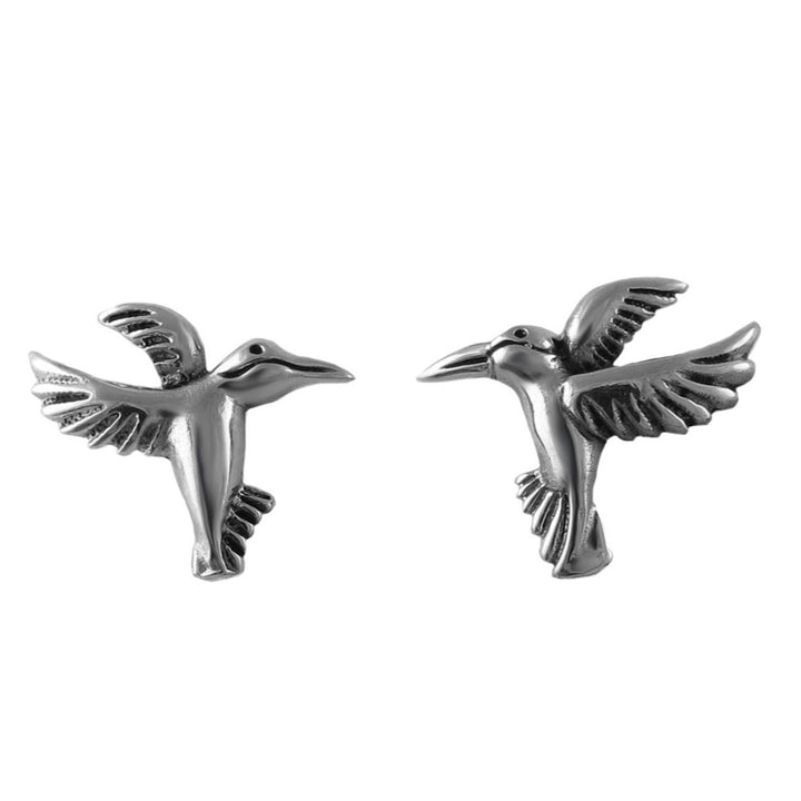 Pair of handmade solid 925 sterling silver bird stud earrings on a white background