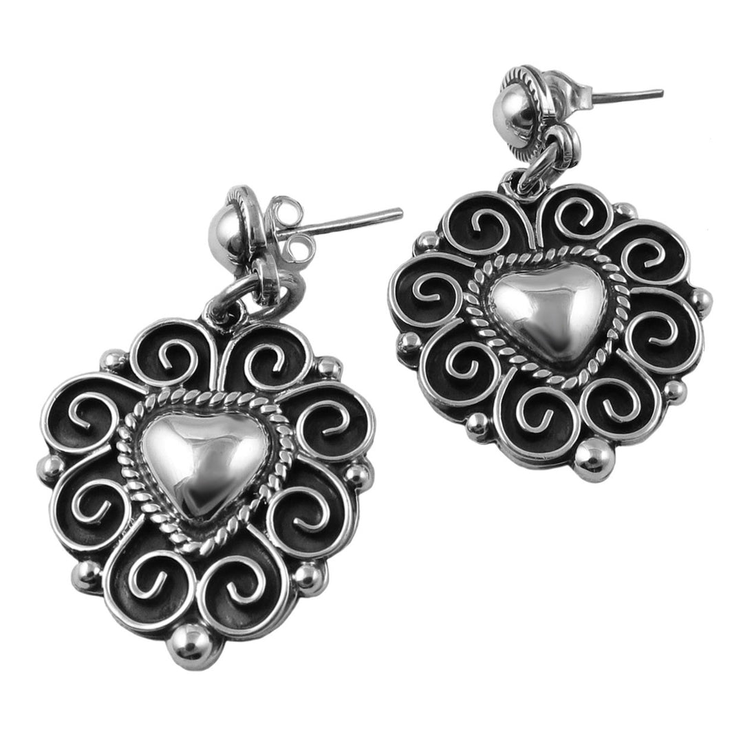 Large Baroque 925 terling silver heart-shaped earrings with intricate designs on a white background