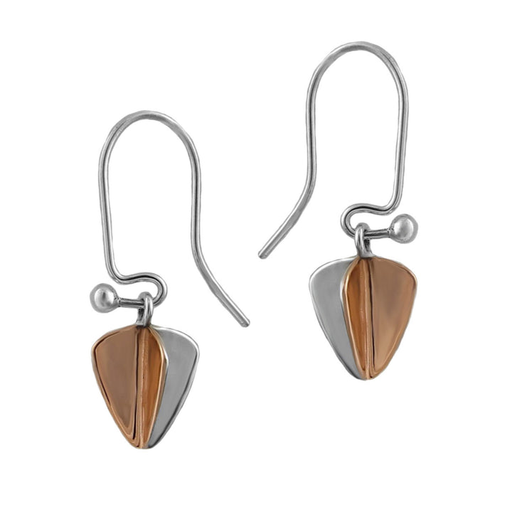 Pair of earrings with polished copper  and silver two tone tree leaf-shaped hook earrings on a white background