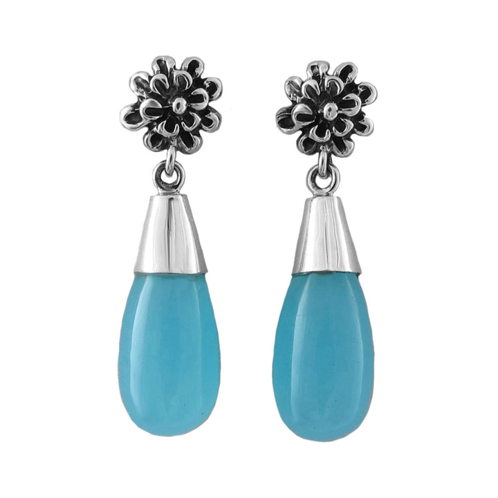 Pair of sterling 925 silver earrings with floral tops and blue chalcedony stones teardrop shapes on a white background