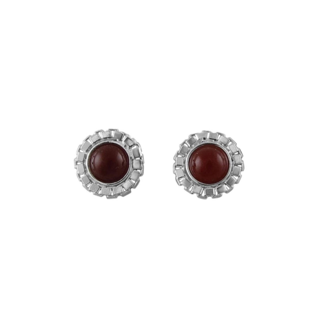 A pair of silver-toned round stud earrings with scalloped textured borders and smooth, round dark reddish-brown carnelian cabochon centres, shown on a plain white background.