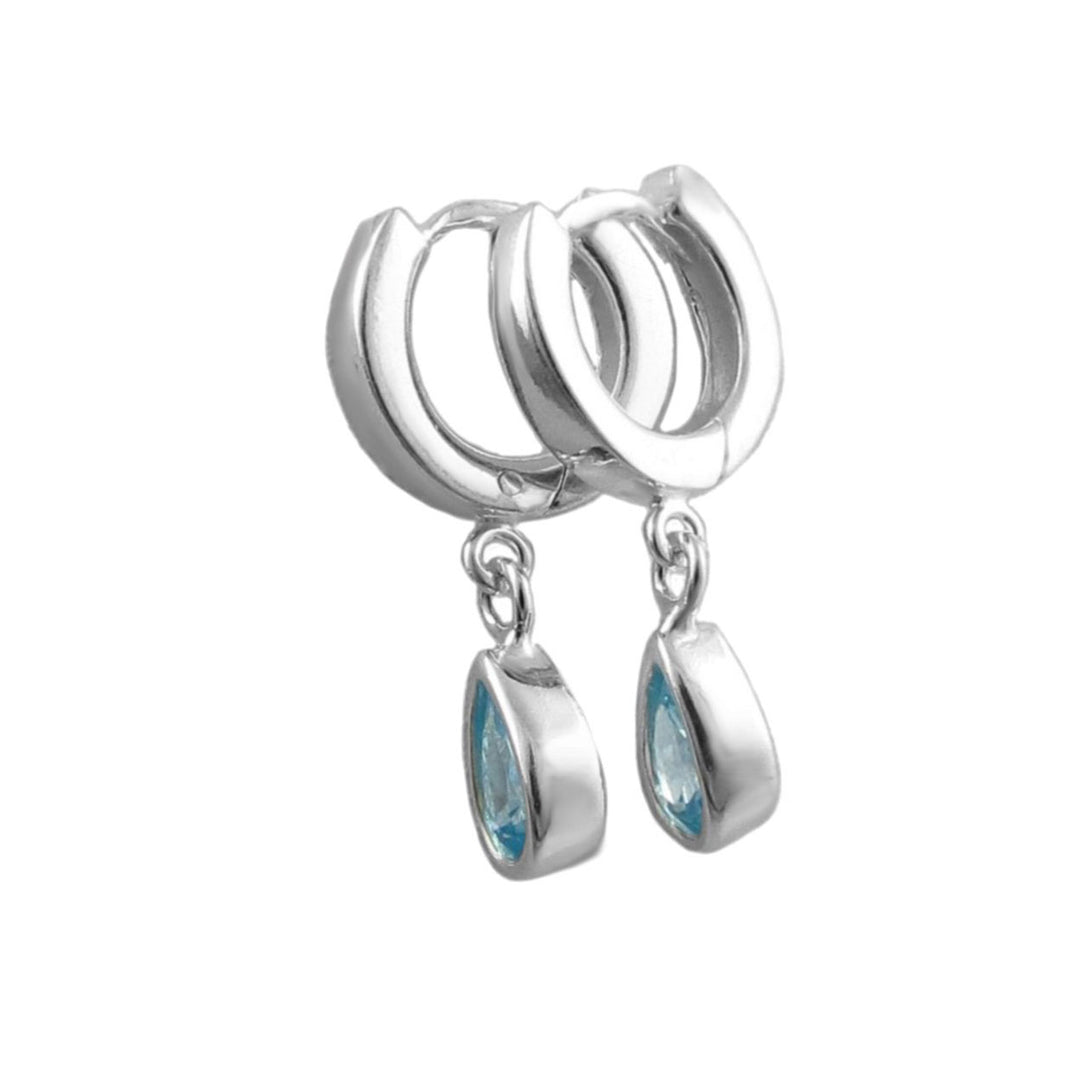 A pair of sterling 925 silver huggie hoop earrings with dangling teardrop-shaped light blue aquamarine gemstone charms, shown on a plain white background.