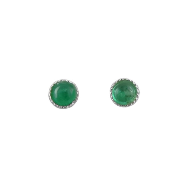 A pair of round stud earrings featuring green natural emerald cabochon gemstones in silver bezel settings with a scalloped edge, shown on a plain white background.