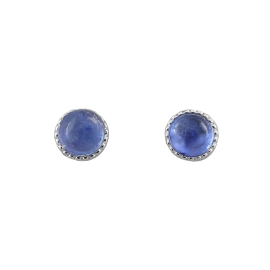 A pair of round stud earrings featuring smooth blue tanzanite cabochon gemstones set in 925 silver bezel settings with a beaded border, shown on a plain white background.