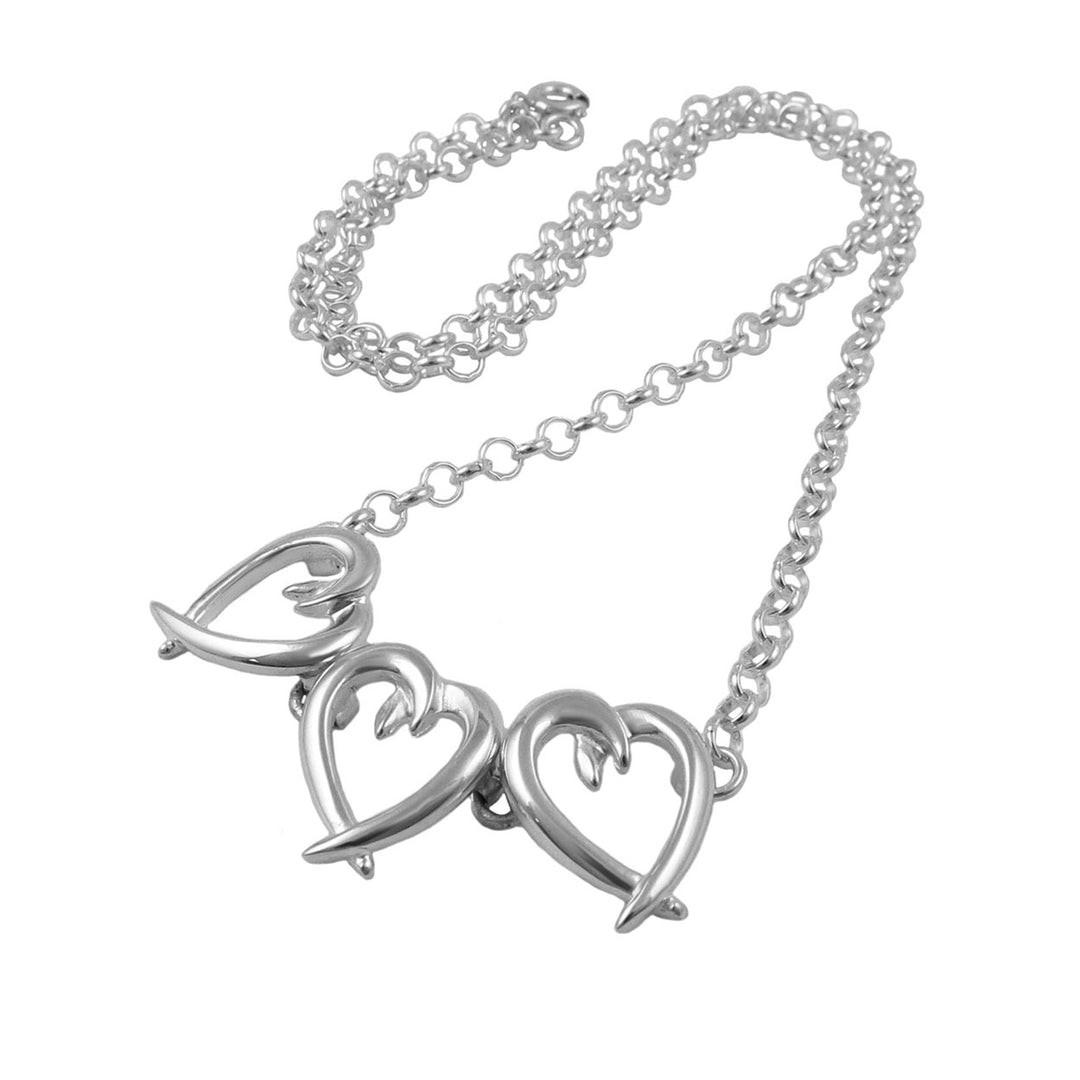 Silver necklace with heart-shaped pendants on a white background