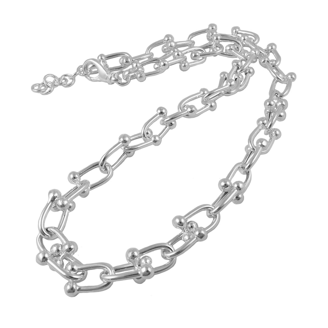 Silver gauge link chain necklace on a white background