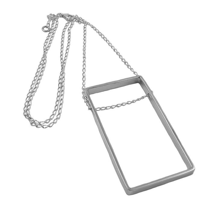 Modern 925 sterling silver rectangular pendant on a curb chain against a white background