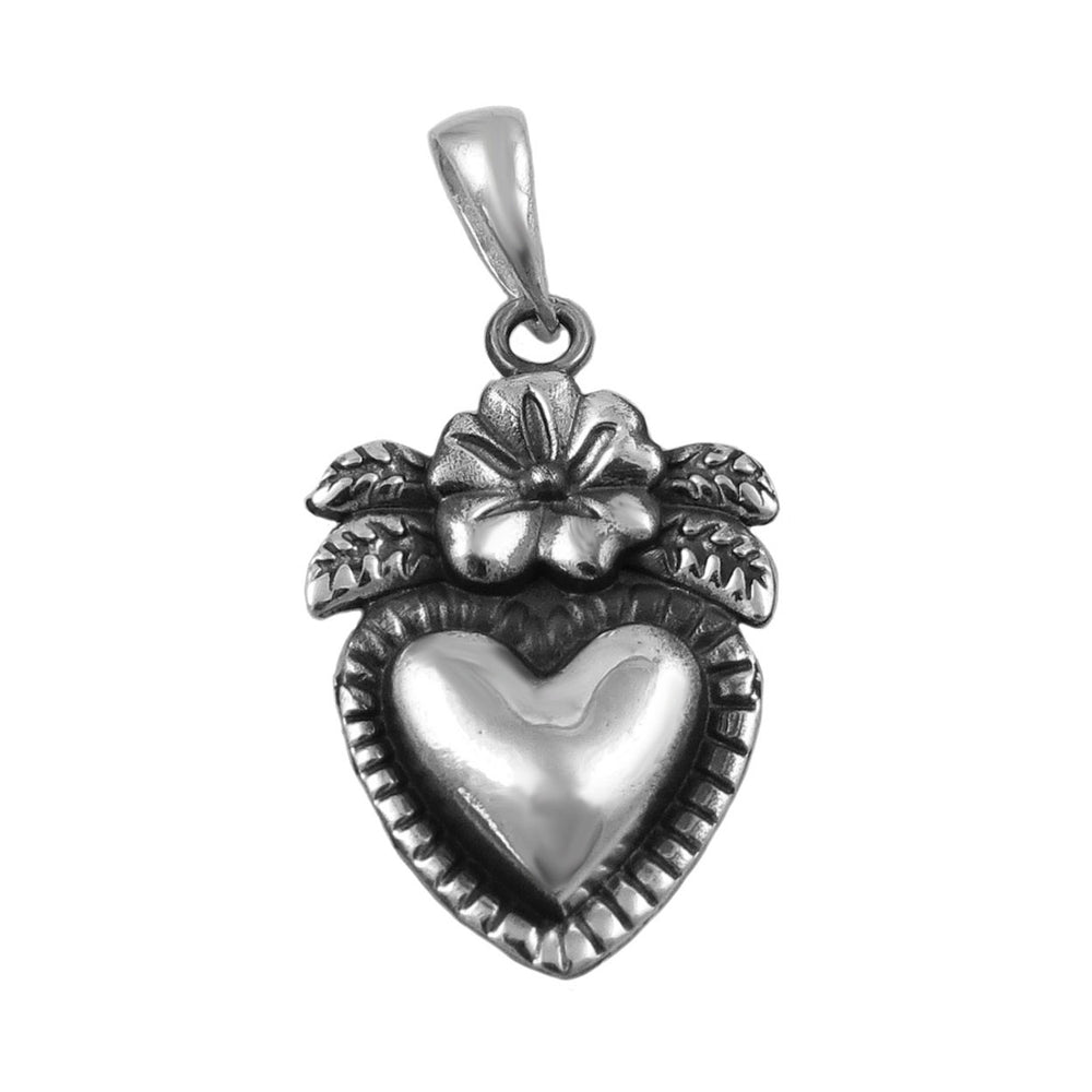 A sterling silver heart-shaped pendant necklace with floral and vine motifs on the pendant.