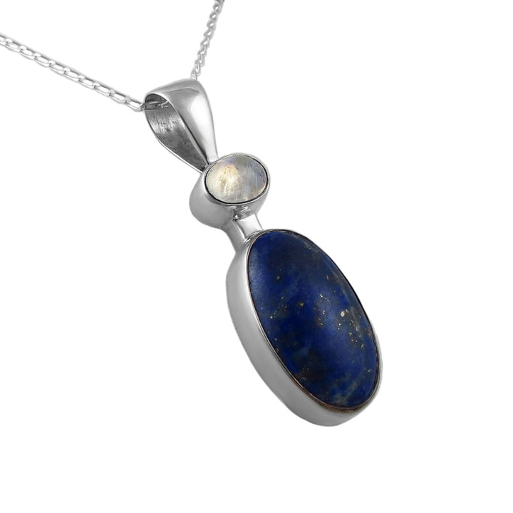 Silver pendant with blue lapis lazuli gemstone and clear moonstone gem on a white background