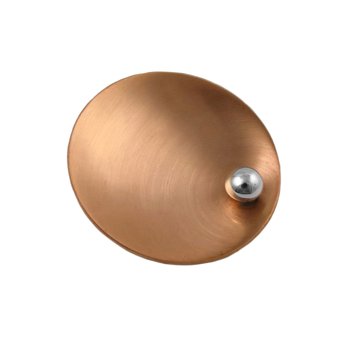 A large brushed copper and 925 silver pendant jewellery on a white background