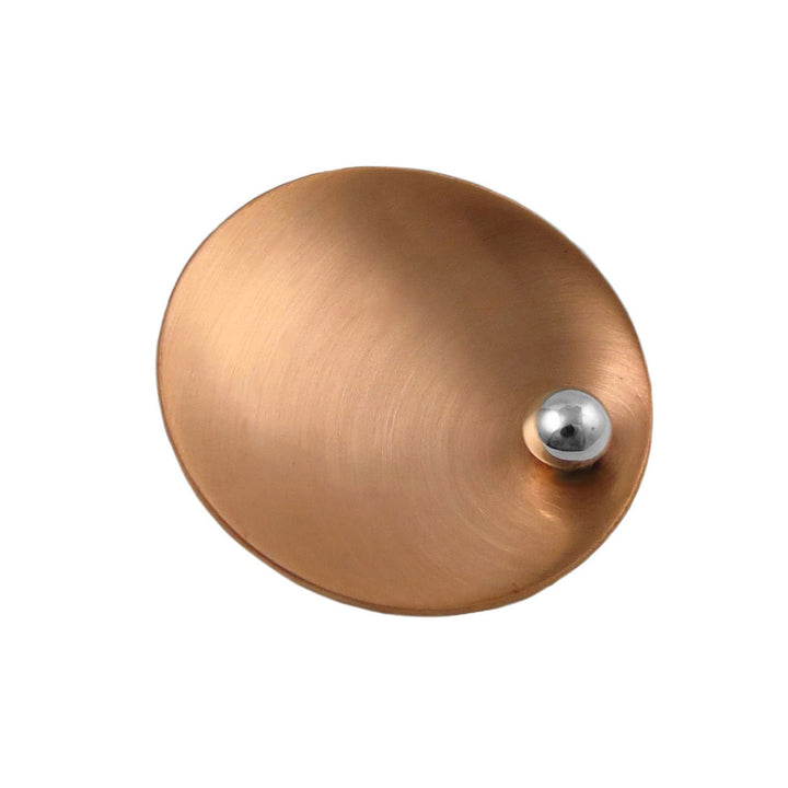 A large brushed copper and 925 silver pendant jewellery on a white background