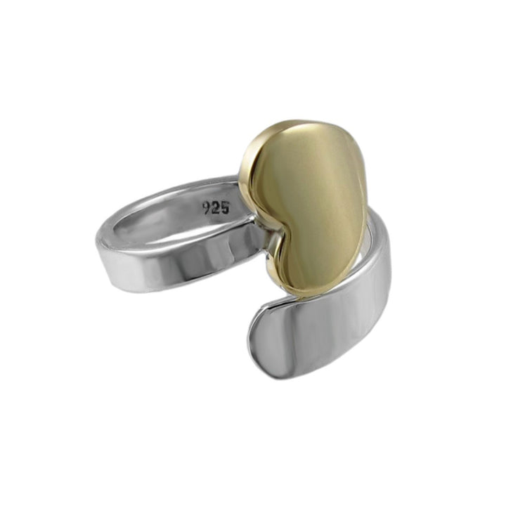 A large two-tone 925 sterling silver spiral ring with a gold heart on a white background
