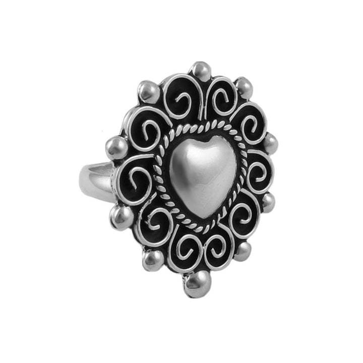 Handmade silver cocktail ring UK featuring a large love heart and spiral border