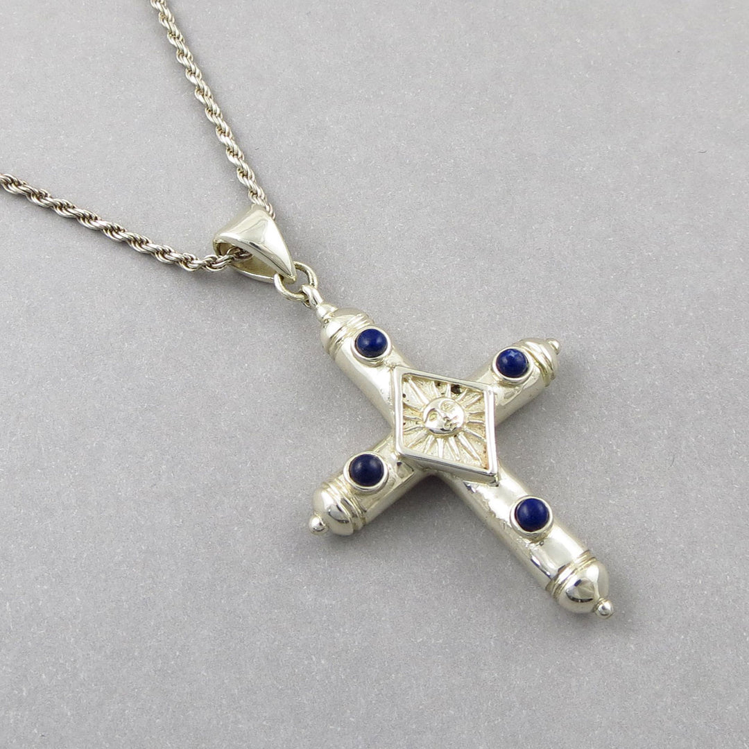 Vintage Sergio Bustamente Mexican sterling 925 Silver cross pendant with lapis lazuli gemstones on a gray background