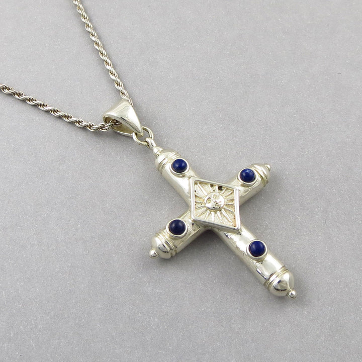 Vintage Sergio Bustamente Mexican sterling 925 Silver cross pendant with lapis lazuli gemstones on a gray background
