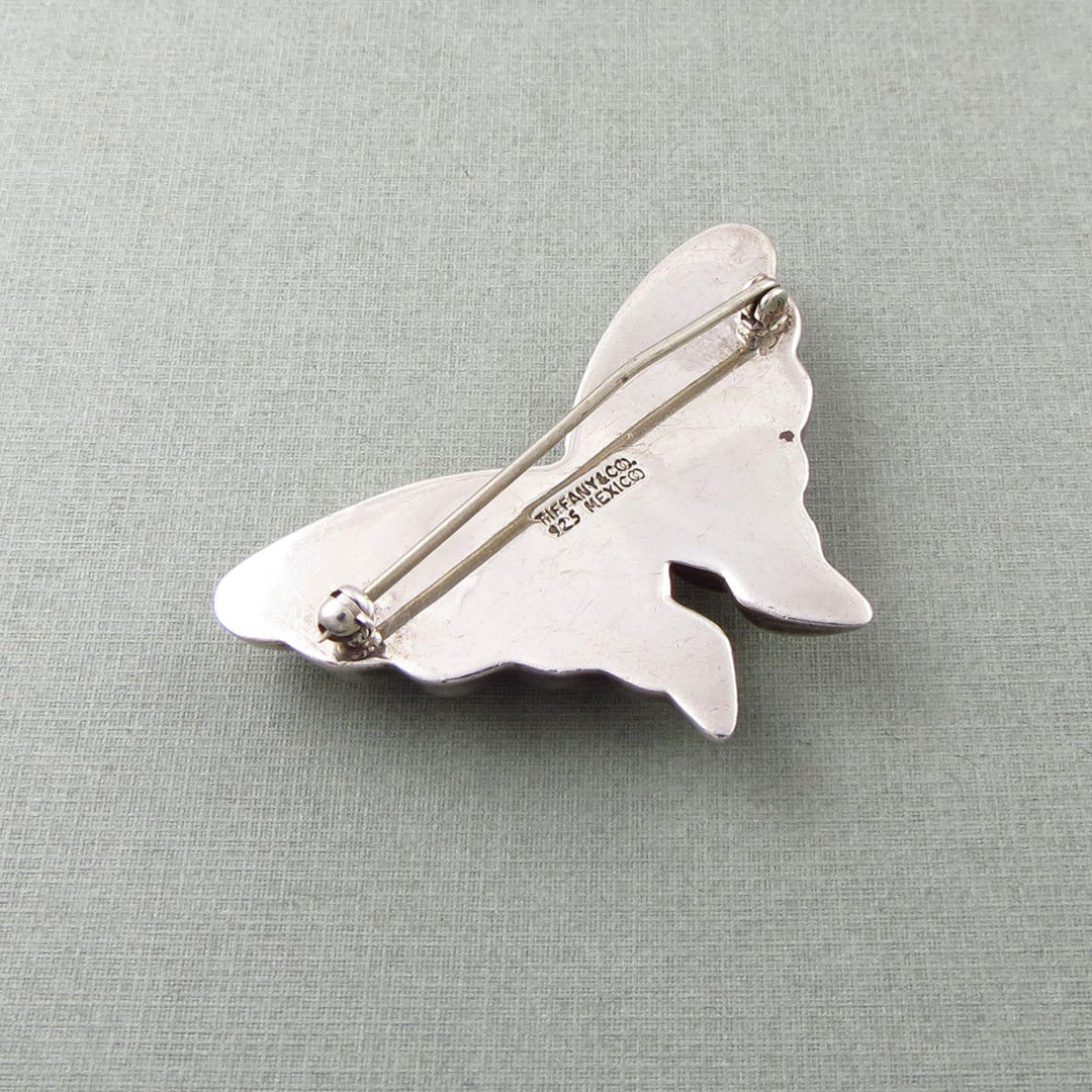 Tiffany & co sterling 925 silver butterfly brooch on a light grey background