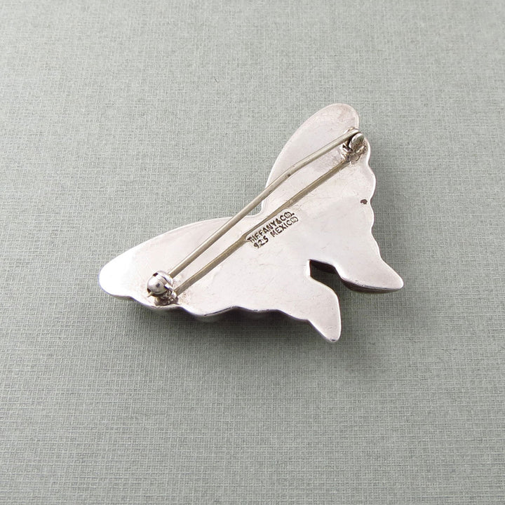 Tiffany & co sterling 925 silver butterfly brooch on a light grey background