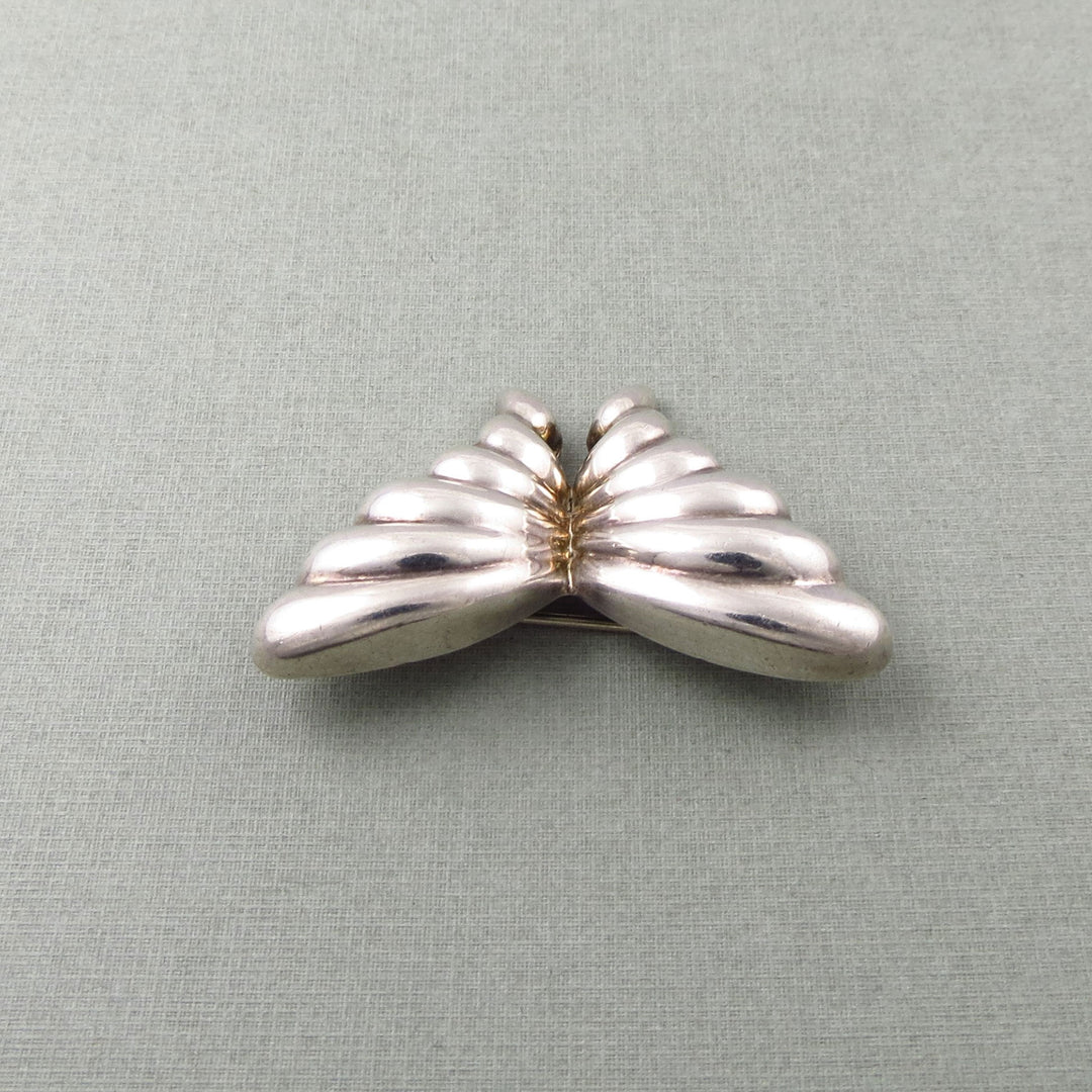 Sterling Silver Tiffany & co vintage butterfly-shaped brooch on a light gray background