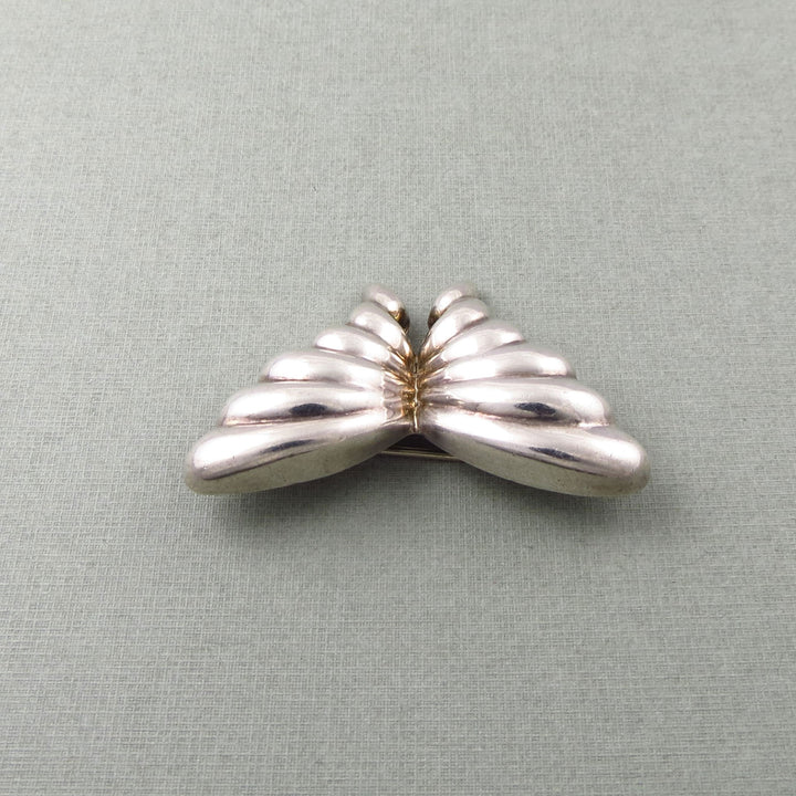 Sterling Silver Tiffany & co vintage butterfly-shaped brooch on a light gray background