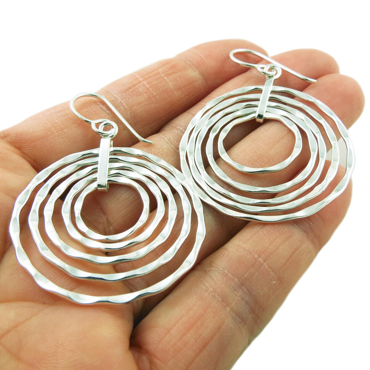 Silver spiral hot sale hoop earrings